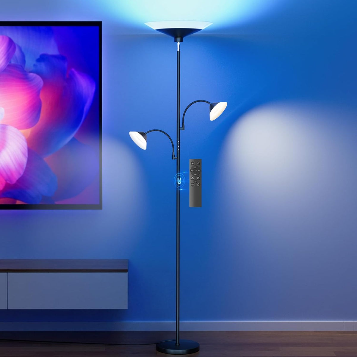 SIBRILLE 3-light torchiere floor lamp: RGB three-light torchiere casting blue light beside a television.