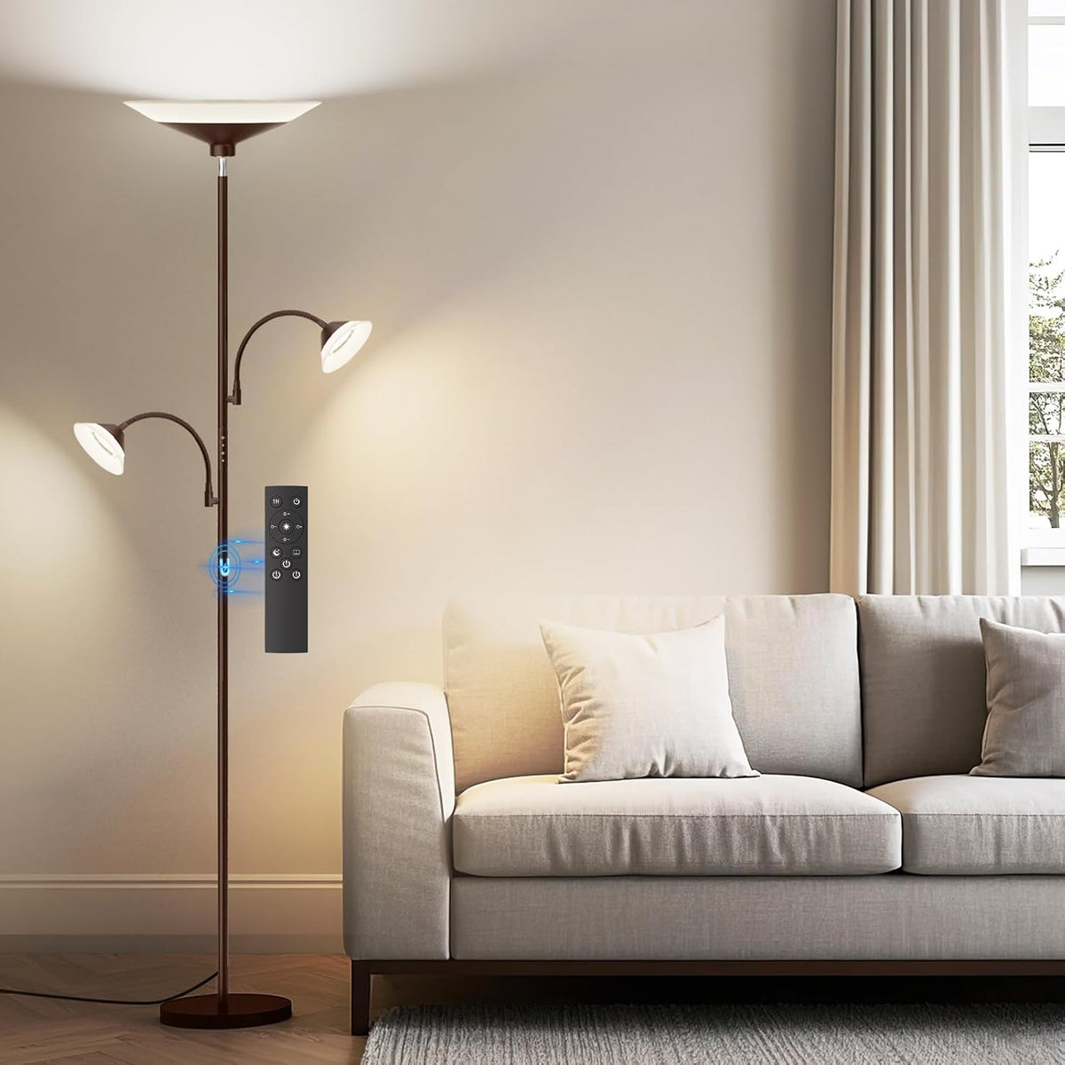 SIBRILLE 3-light torchiere floor lamp: brown torchiere with two reading arms beside a sofa.