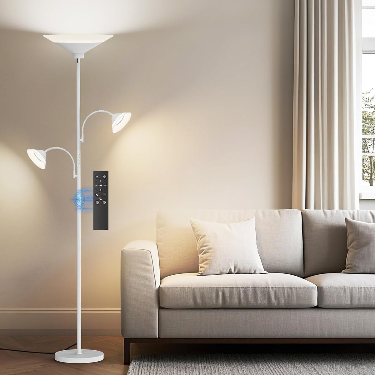 SIBRILLE 3-light torchiere floor lamp: white torchiere with two reading arms beside a sofa.