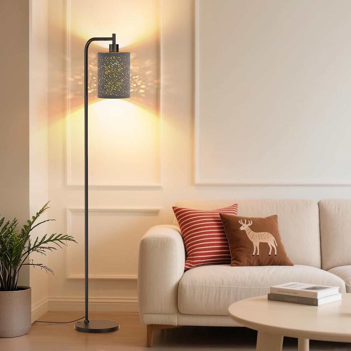 SIBRILLE fabric-shade floor lamp: patterned shade projecting decorative light beside a sofa.