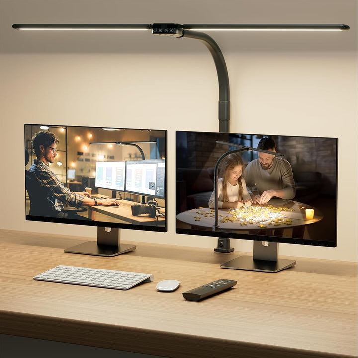 SIBRILLE double-head clamp desk lamp: standard black version above two monitors.