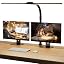 SIBRILLE double-head clamp desk lamp: double-head clamp lamp above a dual-monitor workspace.