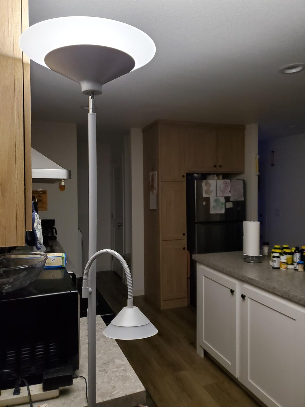 White SIBRILLE 2-in-1 floor lamp glowing in a kitchen