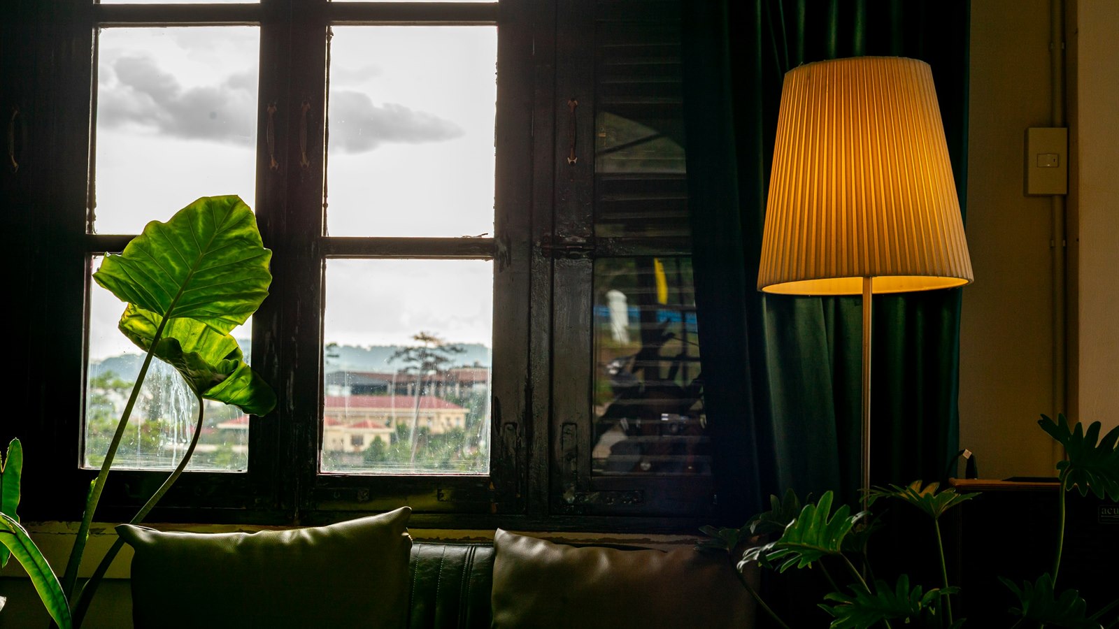 LED floor lamp creating layered ambient light in a room