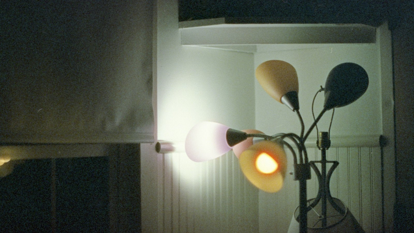 Torchiere floor lamp brightening a contemporary living room corner