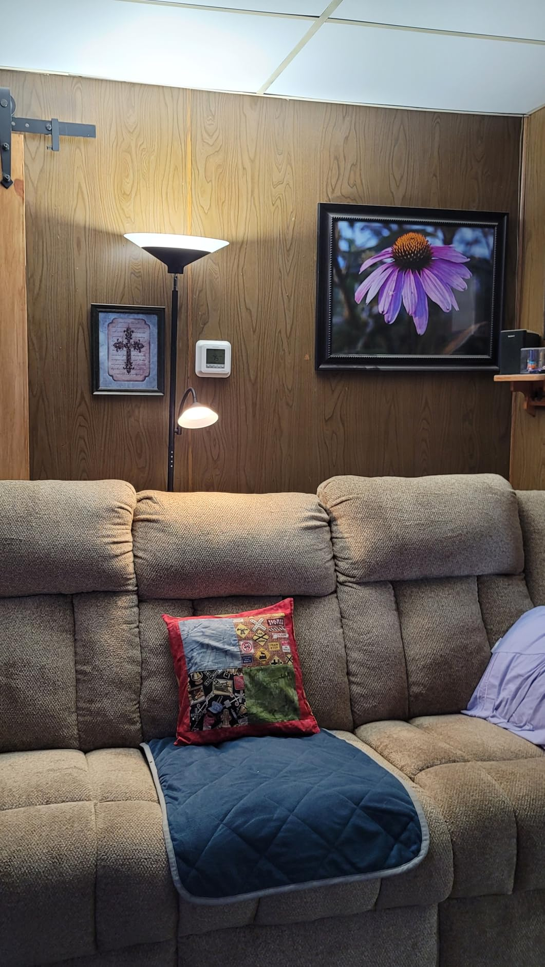 SIBRILLE 2-in-1 floor lamp used as a reading light beside a sofa